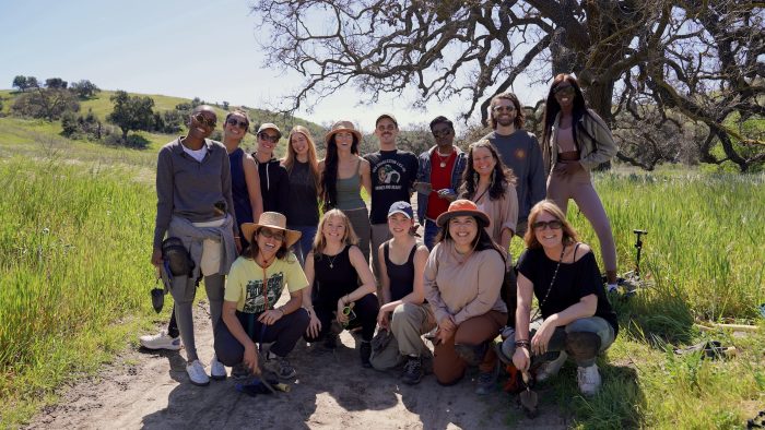 14 environmental volunteers post in the santa monica mountains, during a restoration day